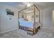 Comfortable bedroom with a beautiful four-poster bed, soft lighting, and stylish decor creating a relaxing retreat at 4011 Fenworth Ct, Fort Mill, SC 29715
