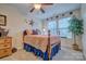 A charming bedroom with a cozy bed, decorative stars, and a lush green plant, creating a warm and inviting atmosphere at 4011 Fenworth Ct, Fort Mill, SC 29715