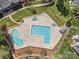 Overhead image of a community pool featuring multiple swimming areas and ample seating for residents to enjoy at 4011 Fenworth Ct, Fort Mill, SC 29715