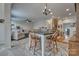 Open floorplan with view of living room and dining area with stylish table and seamless transition into the kitchen at 4011 Fenworth Ct, Fort Mill, SC 29715