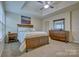 A serene bedroom featuring a tray ceiling, stylish furniture, and soft neutral colors for a tranquil retreat at 4011 Fenworth Ct, Fort Mill, SC 29715