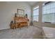 Inviting sunroom featuring large windows, a piano, and neutral tones creating a warm and welcoming atmosphere at 4011 Fenworth Ct, Fort Mill, SC 29715