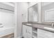 Bathroom features a double vanity with granite countertops and modern fixtures, alongside a tub and shower combo at 4036 Meadowview Hills Dr # 7, Charlotte, NC 28269