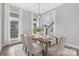 Light filled dining room with pendant lighting and large windows at 4036 Meadowview Hills Dr # 7, Charlotte, NC 28269