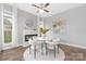Inviting dining area with a modern fireplace and stylish decor at 4036 Meadowview Hills Dr # 7, Charlotte, NC 28269