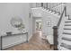 Stylish foyer with dark wood accents and an open staircase at 4036 Meadowview Hills Dr # 7, Charlotte, NC 28269