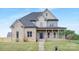 Charming two-story brick home with a welcoming front porch and well-manicured lawn at 4036 Meadowview Hills Dr # 7, Charlotte, NC 28269