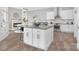 Bright kitchen features a granite island, white cabinets, stainless steel appliances, and modern finishes at 4036 Meadowview Hills Dr # 7, Charlotte, NC 28269