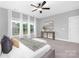 Airy primary bedroom with a ceiling fan, lots of natural light, and modern decor at 4036 Meadowview Hills Dr # 7, Charlotte, NC 28269