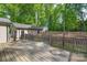 Spacious wooden backyard deck overlooking a well-manicured green lawn at 4256 Wood Forest Dr, Rock Hill, SC 29732