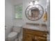 Bathroom featuring a decorative mirror, stylish vanity, and natural light at 4256 Wood Forest Dr, Rock Hill, SC 29732