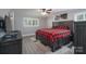 Cozy bedroom featuring a large bed with a patterned blanket and a TV, perfect for relaxation at 4256 Wood Forest Dr, Rock Hill, SC 29732