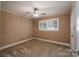 Bedroom featuring a ceiling fan, wall paneling, and carpeted floor at 4256 Wood Forest Dr, Rock Hill, SC 29732