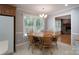 Cozy dining area features a round wood table, chairs, and a window overlooking the backyard at 4256 Wood Forest Dr, Rock Hill, SC 29732