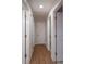 Hallway with hardwood floors and multiple doors, leading to various rooms in the house at 4256 Wood Forest Dr, Rock Hill, SC 29732