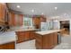 Full view of kitchen with stainless steel appliances, wood cabinets, large island, and dining nook at 4256 Wood Forest Dr, Rock Hill, SC 29732