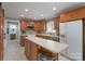 Well-equipped kitchen with wooden cabinets, stainless steel appliances, and an island for food preparation at 4256 Wood Forest Dr, Rock Hill, SC 29732