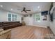 Expansive living room boasts hardwood floors, ample natural light, and plenty of space for entertaining at 4256 Wood Forest Dr, Rock Hill, SC 29732