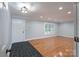 Inviting living room with refinished floors, ample light, and open doorway at 4256 Wood Forest Dr, Rock Hill, SC 29732