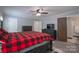 Comfortable bedroom featuring ample space, TV, ceiling fan, and a door to the on-suite bathroom at 4256 Wood Forest Dr, Rock Hill, SC 29732