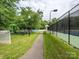 Serene walking path winds through the community, passing by the playground and tennis courts, inviting residents to enjoy nature at 4743 Morning Dew Ct # 4743, Charlotte, NC 28269
