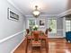 Bright dining room with wood floors, neutral walls, and a view of the backyard at 4743 Morning Dew Ct # 4743, Charlotte, NC 28269