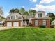 Charming two-story home with a manicured lawn, brick accents, and a two car garage at 4743 Morning Dew Ct # 4743, Charlotte, NC 28269