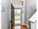 Bright foyer showcasing wood floors and a storm door with lots of natural light at 4743 Morning Dew Ct # 4743, Charlotte, NC 28269