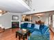 Cozy living room featuring a fireplace, wood floors, and an open layout at 4743 Morning Dew Ct # 4743, Charlotte, NC 28269
