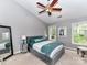 Vaulted ceiling primary bedroom with plush bed and bright windows at 4743 Morning Dew Ct # 4743, Charlotte, NC 28269