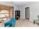 Loft sitting area with natural light and bookshelf at 4743 Morning Dew Ct # 4743, Charlotte, NC 28269