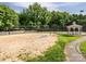 Community sand volleyball court adjacent to a gazebo and tennis court for residents' enjoyment at 4743 Morning Dew Ct # 4743, Charlotte, NC 28269