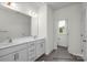 Bright bathroom featuring a double sink vanity, white cabinets, and modern fixtures at 5104 Shasta St # 5104, Gastonia, NC 28052