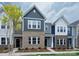 New townhouse with modern architecture with brick and siding exterior, and manicured lawn at 5104 Shasta St # 5104, Gastonia, NC 28052