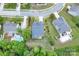 Aerial view of a home, landscaped yard, and a fenced in backyard with mature trees at 5135 Norway Ln, Rock Hill, SC 29732