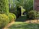Lush backyard features landscaped garden beds and privacy trees at 5135 Norway Ln, Rock Hill, SC 29732