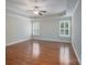 A spacious bedroom offers hardwood floors, a ceiling fan, and two windows providing natural light at 5135 Norway Ln, Rock Hill, SC 29732