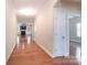 Inviting hallway featuring hardwood floors and access to multiple rooms at 5135 Norway Ln, Rock Hill, SC 29732