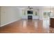 Open living room with hardwood floors, fireplace, and abundant natural light at 5135 Norway Ln, Rock Hill, SC 29732