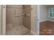 Newly renovated shower stall with tile surround, grab bars, and a built-in seat at 5135 Norway Ln, Rock Hill, SC 29732