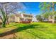 Spacious backyard featuring a well-maintained lawn and a charming deck, perfect for outdoor entertaining at 609 Tysons Forest Dr, Rock Hill, SC 29732