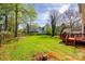 Expansive backyard featuring a lush lawn and a cozy deck, ideal for outdoor enjoyment at 609 Tysons Forest Dr, Rock Hill, SC 29732