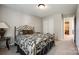 Neutral bedroom with a metal frame bed and view to bath at 609 Tysons Forest Dr, Rock Hill, SC 29732