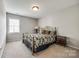 Neutral-toned bedroom featuring a decorative metal frame bed at 609 Tysons Forest Dr, Rock Hill, SC 29732