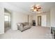 Spacious bonus room with a ceiling fan and a comfortable gray sofa at 609 Tysons Forest Dr, Rock Hill, SC 29732