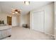 Spacious bonus room featuring plush carpet, ceiling fan, and large closet for versatile living and storage at 609 Tysons Forest Dr, Rock Hill, SC 29732