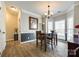 Inviting dining area with a chandelier, creating a warm atmosphere for gatherings at 609 Tysons Forest Dr, Rock Hill, SC 29732