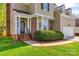Charming two-story home boasts well-manicured lawn, brick accents, and attached garage under bright blue skies at 609 Tysons Forest Dr, Rock Hill, SC 29732