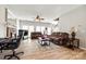 The living room has wood floors, a ceiling fan, and large windows, creating a warm and inviting atmosphere at 609 Tysons Forest Dr, Rock Hill, SC 29732