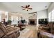 The living room features a brick fireplace and wood floors, seamlessly blending comfort and style at 609 Tysons Forest Dr, Rock Hill, SC 29732